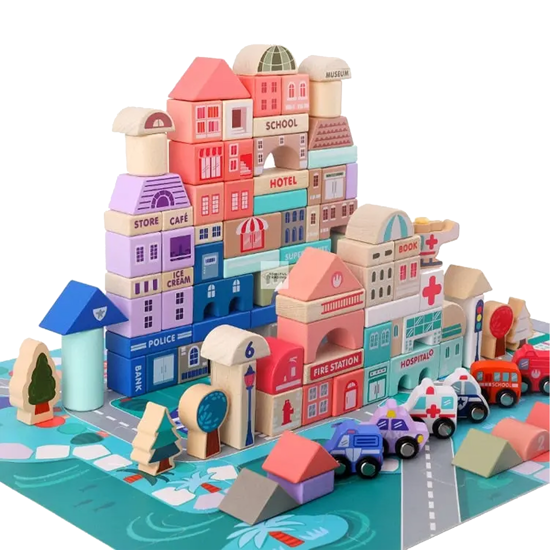 Colorful Soulful Trading Montessori large building blocks toy representing a toy town with structures labeled as school, hotel, cafe, and hospital, including small toy vehicles and trees, on a patterned mat.