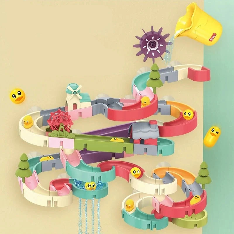 Interactive wall suction baby bath toy marble run with multiple tracks, gears, and cheerful duck faces on a light background by Soulful Trading.