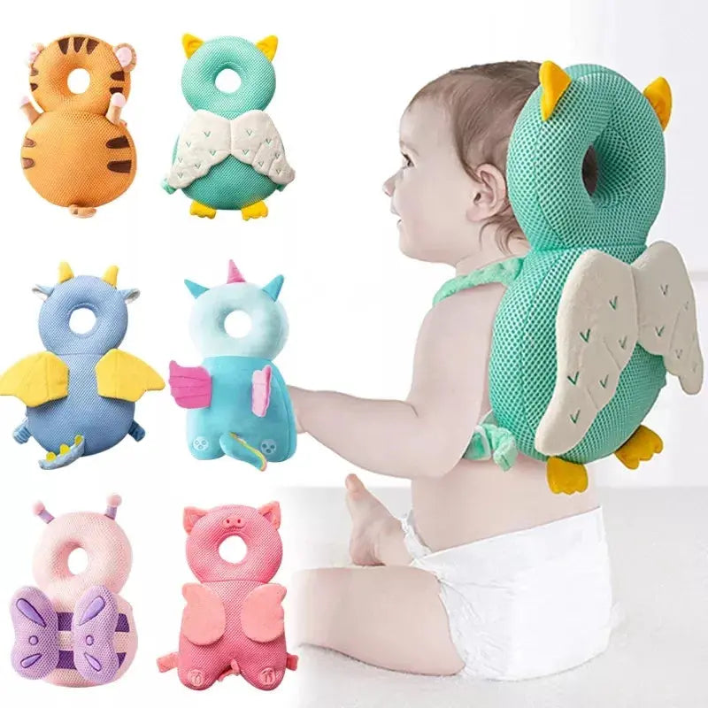 A baby sitting with various Soulful Trading Baby Safety Cushions, including a unicorn, owl, and dragon designs, displayed around.