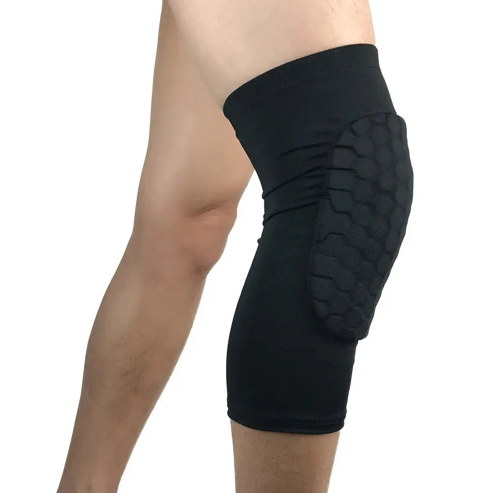Side view of a person wearing a black padded Soulful Trading Honeycomb Anti Collision Knee Pad, isolated on a white background.