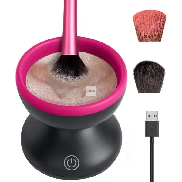 Electric Soulful Trading makeup brush cleaner with a pink and black design, shown with a brush inside, alongside two detached brush heads and a USB cable for deep cleaning makeup brushes.