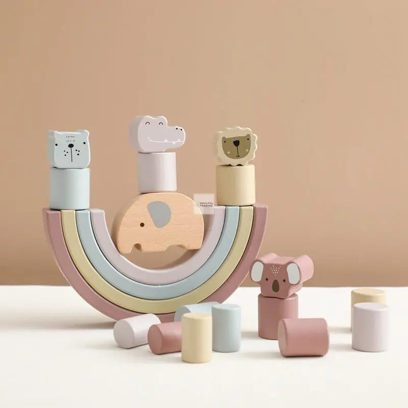 Montessori Educational Wooden Elephant Balance Toy featuring animal-shaped blocks arranged in a rainbow design on a beige background, crafted from non-toxic materials by Soulful Trading.