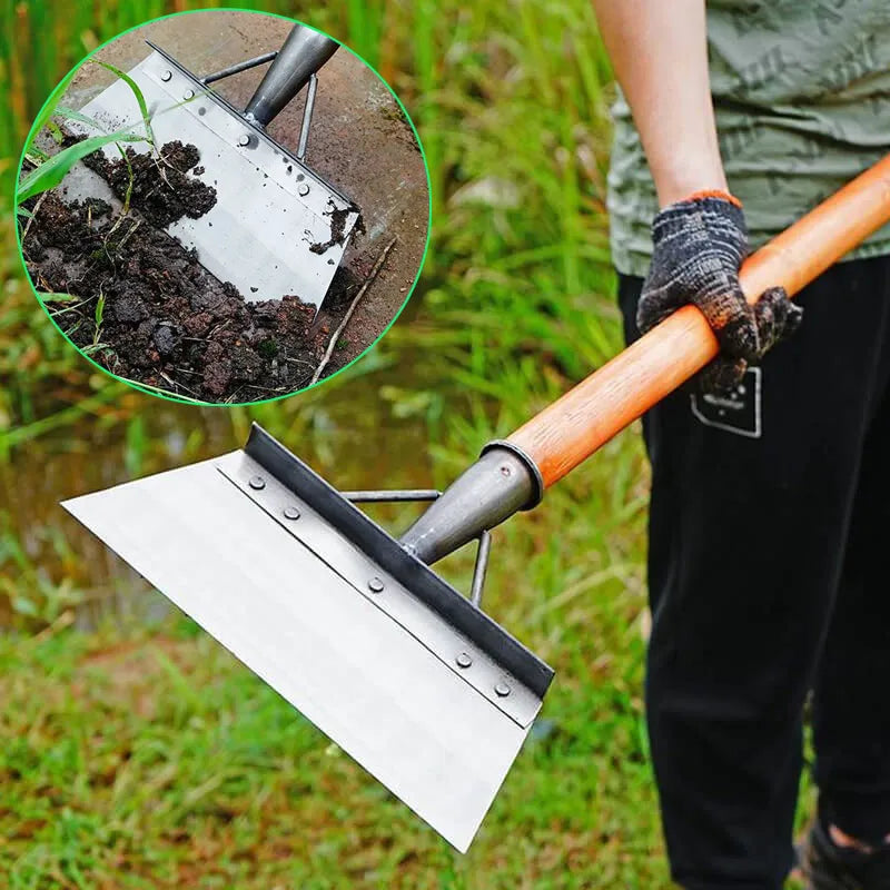 Person in gloves holding a Soulful Trading Flat Head Garden Cleaning Shovel with a soil sample on the blade, standing outdoors with focus on the tool.