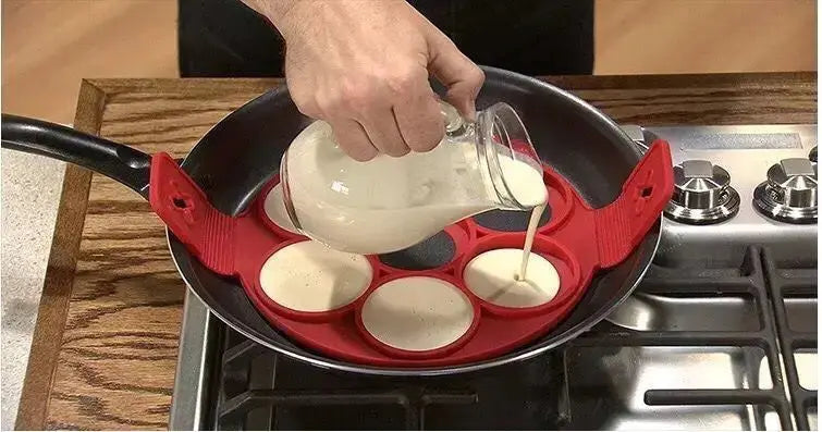 A person pours pancake batter into a Soulful Trading Flip &