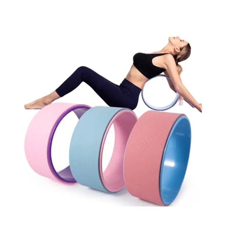 A woman in exercise attire stretches on a blue Fitness-8 Yoga Pilates Circle Wheel, with other colorful yoga wheels displayed in front.
